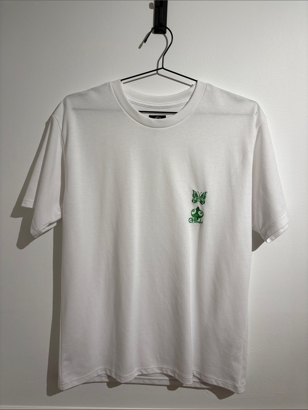 Needles White Short Sleeve Crewneck Tee with Green Chest Motif